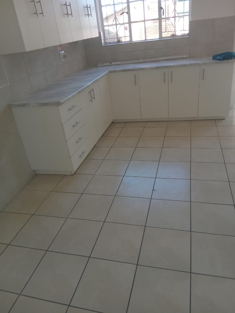 Sinqobile Construction Kitchen tiling project by Sinqobile Construction in Linden - Professional construction work